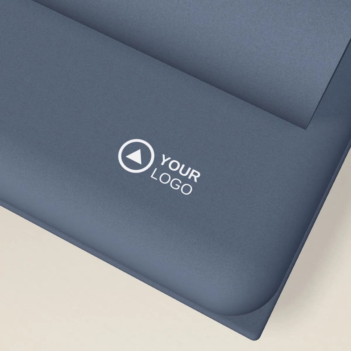 Close-up of the logo branding on the Recycled PET Fleece Blanket in Gift Box